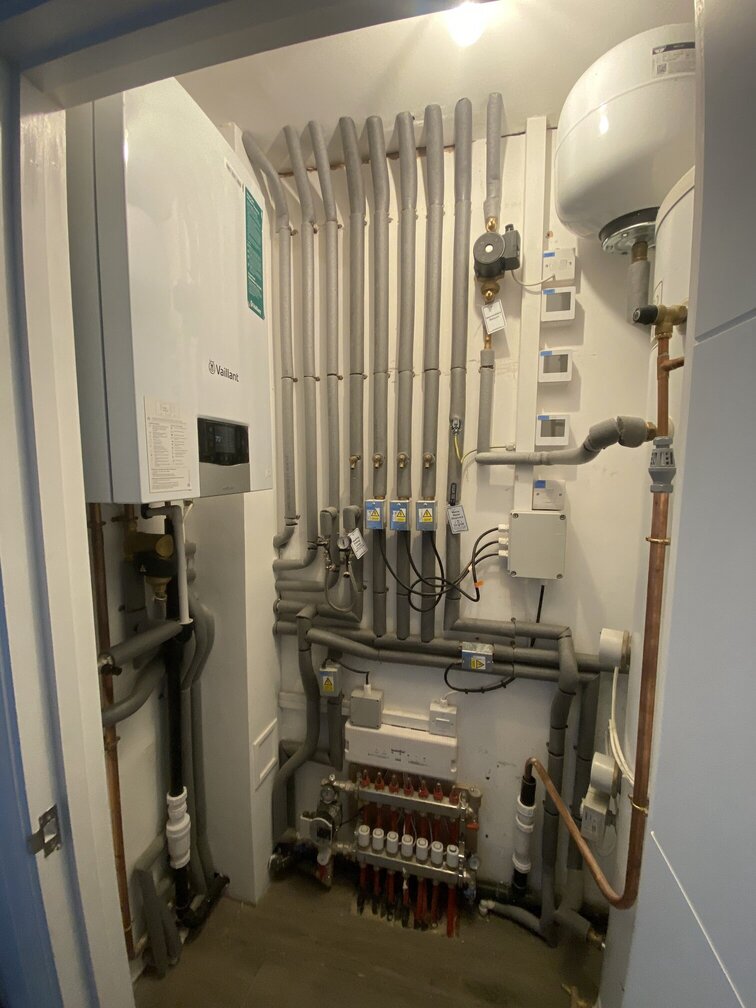 Boiler, cylinder and under floor heating installation.